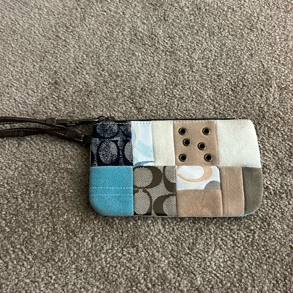 patched pattern coach clutch bag